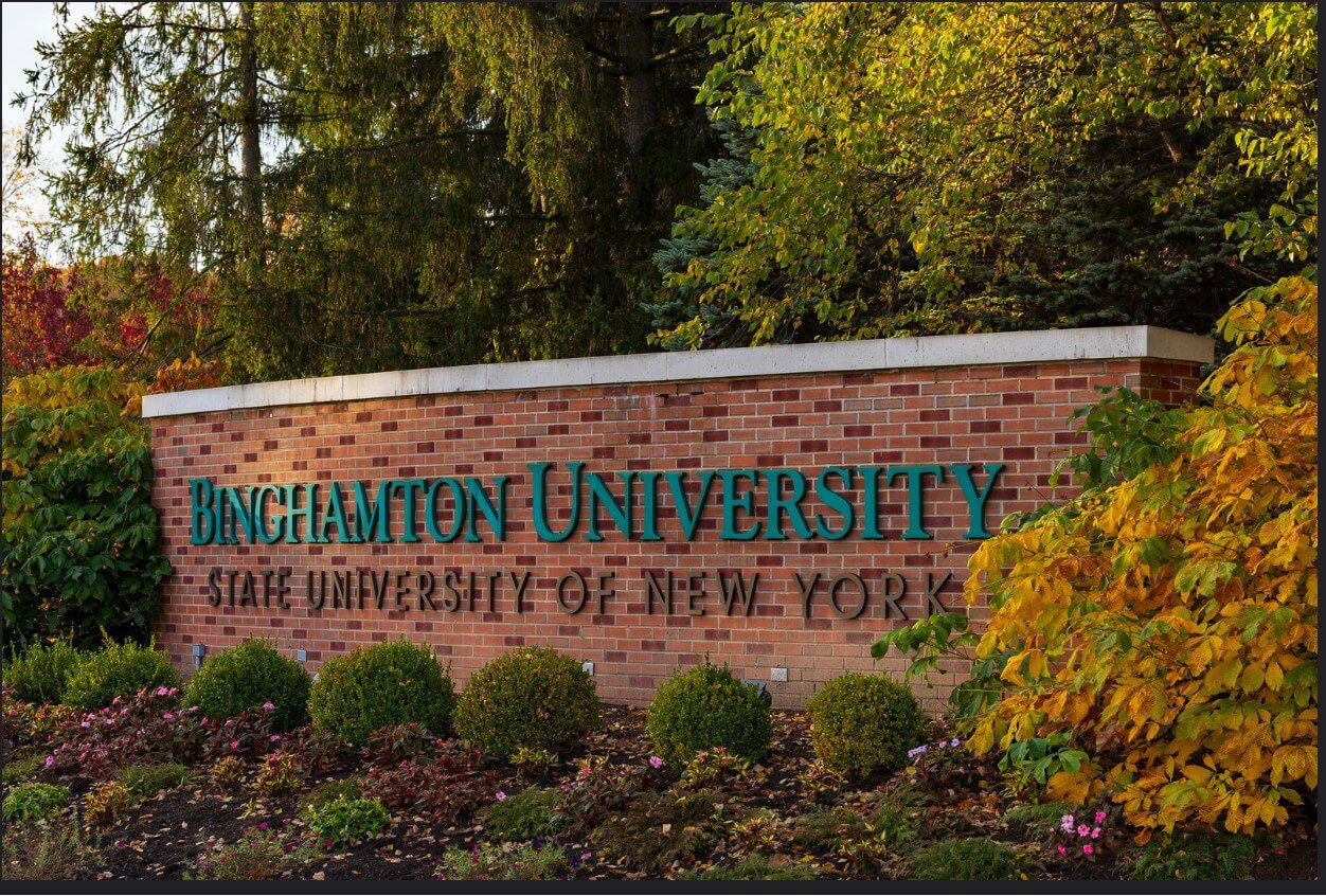 brick wall with the words Binghamton University on it