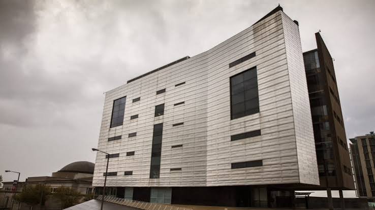 A photograph of the Southern Poverty Law Center building on a cloudy day
